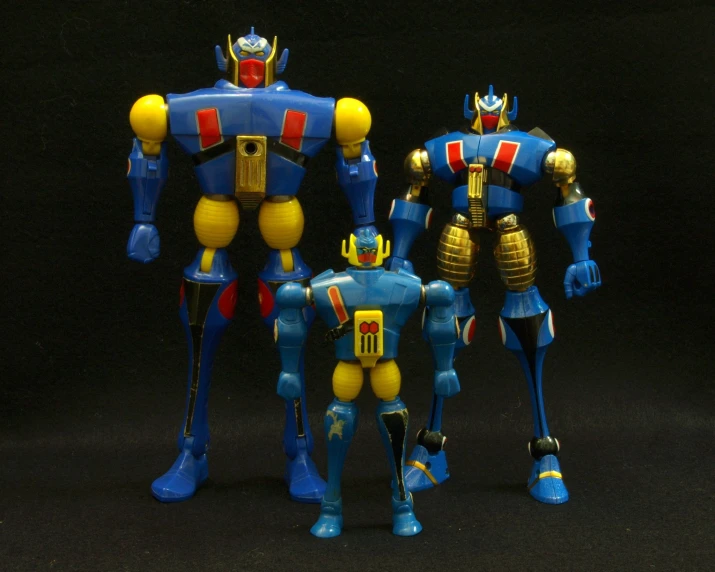 two figurines are dressed up like robot suit