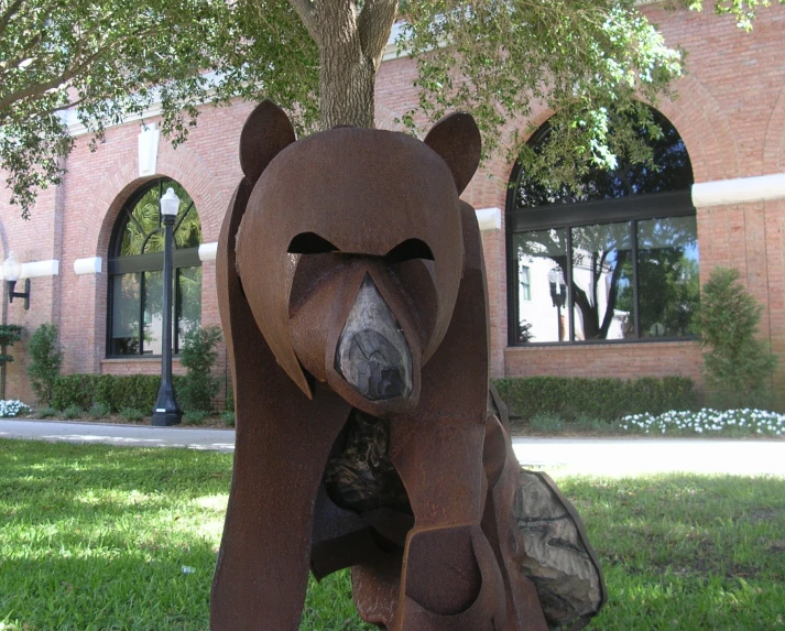 the bear sculpture was in front of a brick building