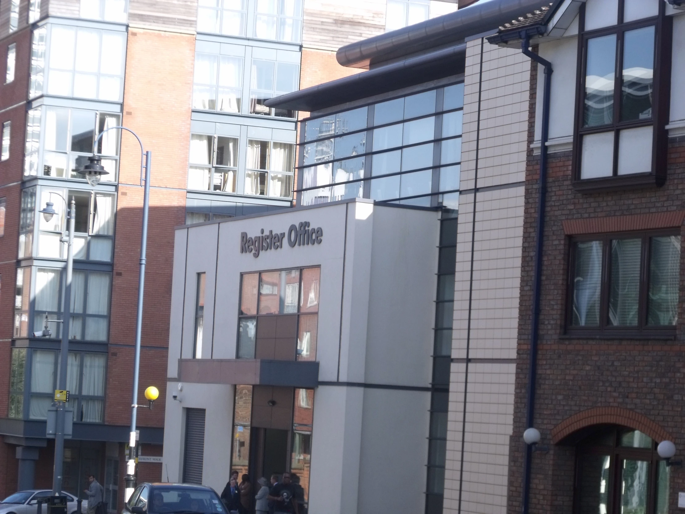 a view of a row of parked cars and some buildings