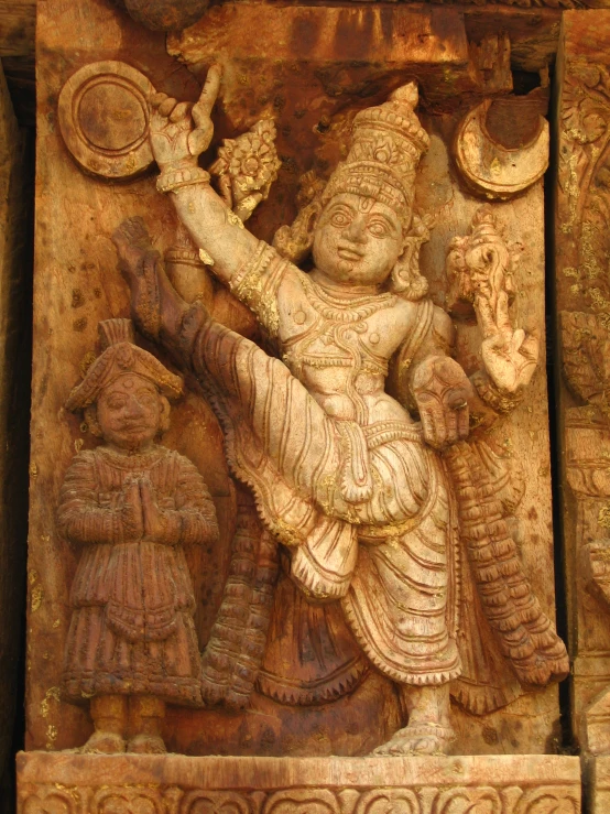 a carved stone carving of an indian warrior