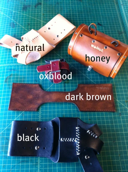different leather items laying on a tiled table