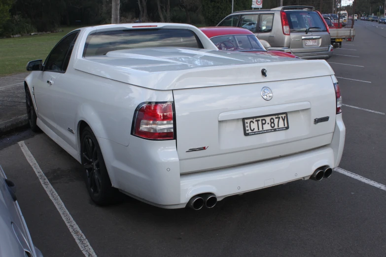 a close up of many cars parked in a parking lot