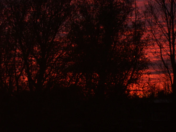 an image of a sunset or sunrise with clouds