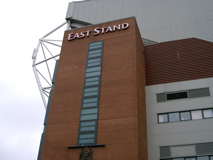 a brick building with an east stand sign on top