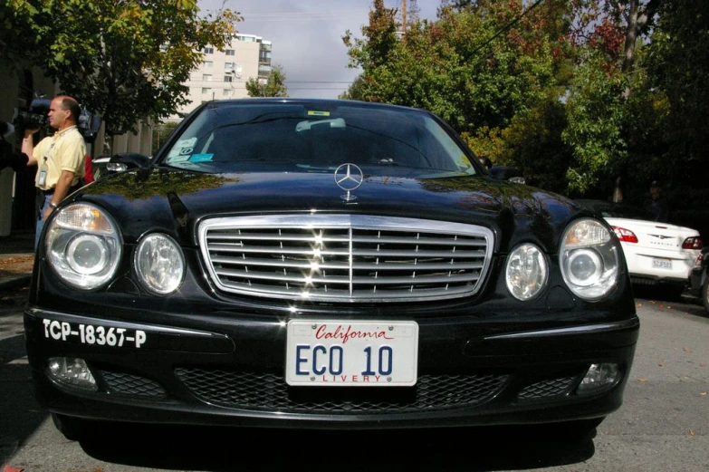 the front end of a car on a street