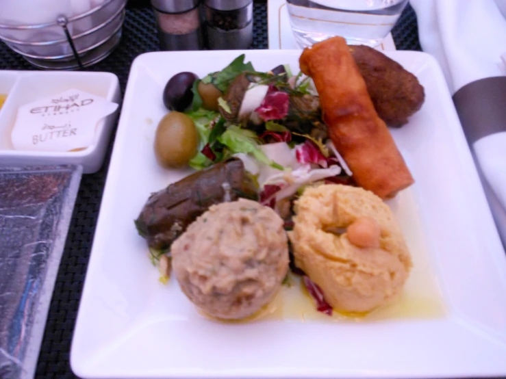 a white plate with different food items on it