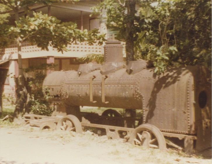 an old train engine with multiple carts behind it