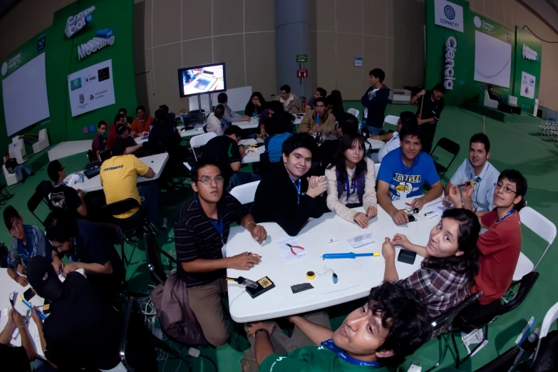 many people sitting at tables during an event