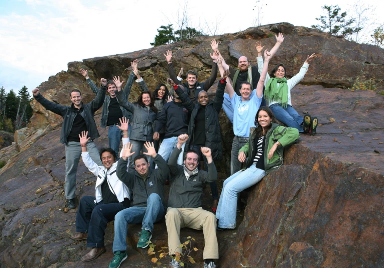 a group of people are posing for a picture