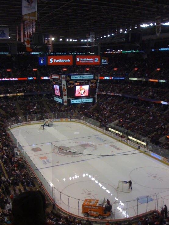 a hockey rink with many people on it