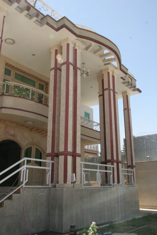 a white building with red and white stripes