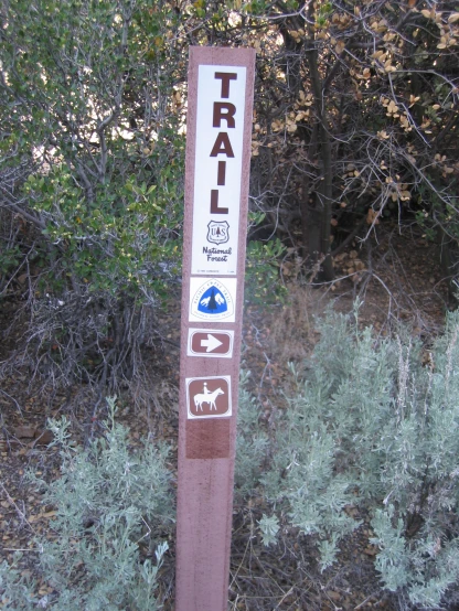 a sign warning of trails for the horse to go