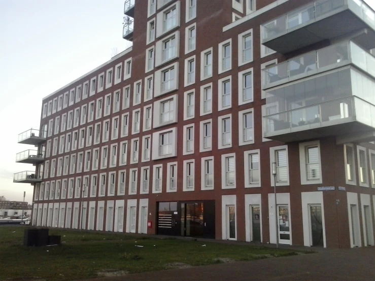 a building in a city has several balconies on the second floor