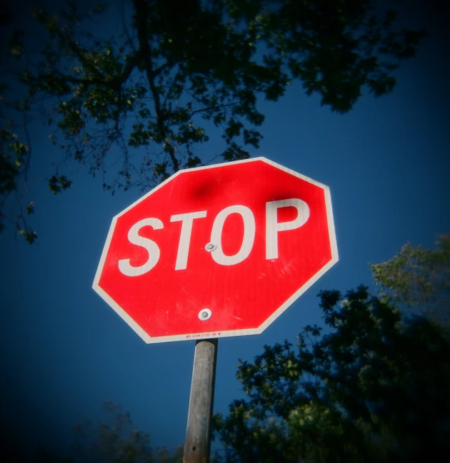 stop sign and blue sky on a sunny day