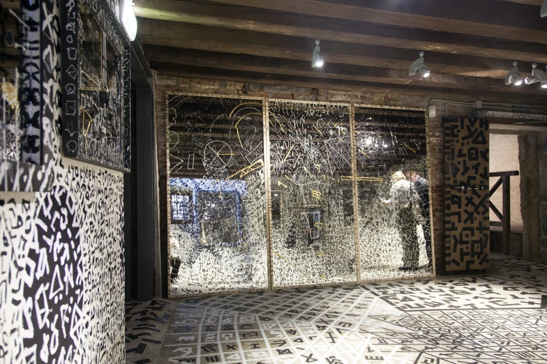 a bathroom with tiled floor, walls and ceiling