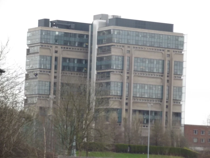 two large buildings side by side on a gloomy day