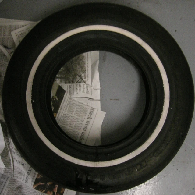 a rolled up piece of newspaper and tire