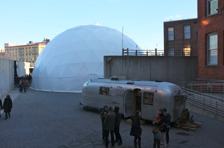 a group of people outside an outdoor building