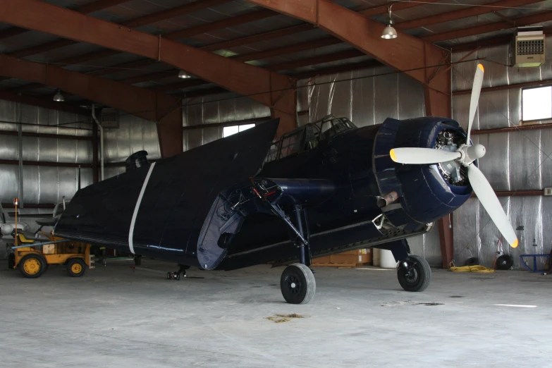 an old airplane that is inside a building