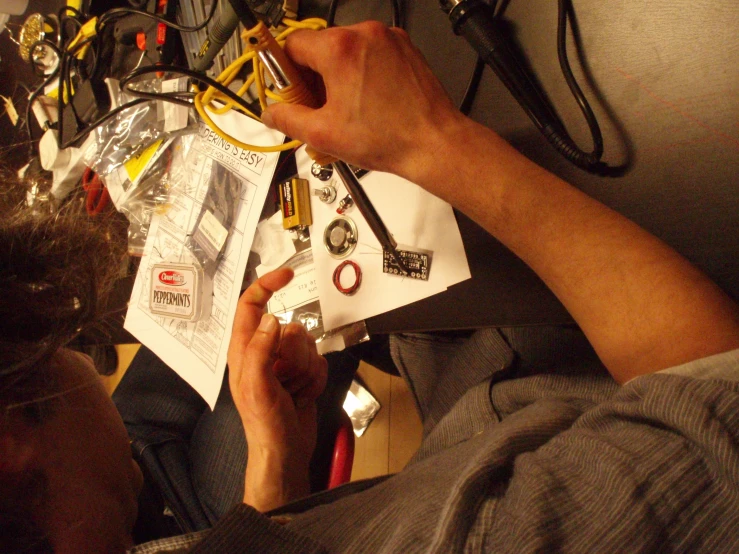 a person working on a electrical circuit with multiple wires