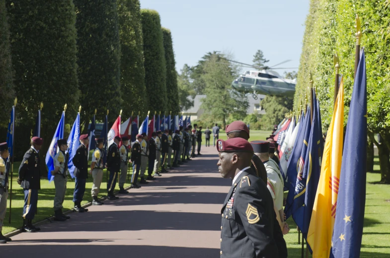 the line of people in uniform has many flags