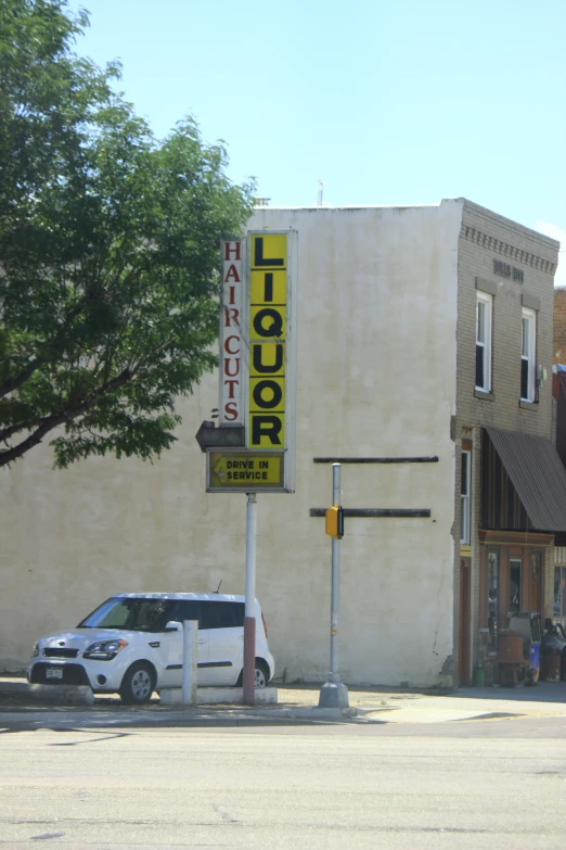 a car sits parked in front of a footlock store