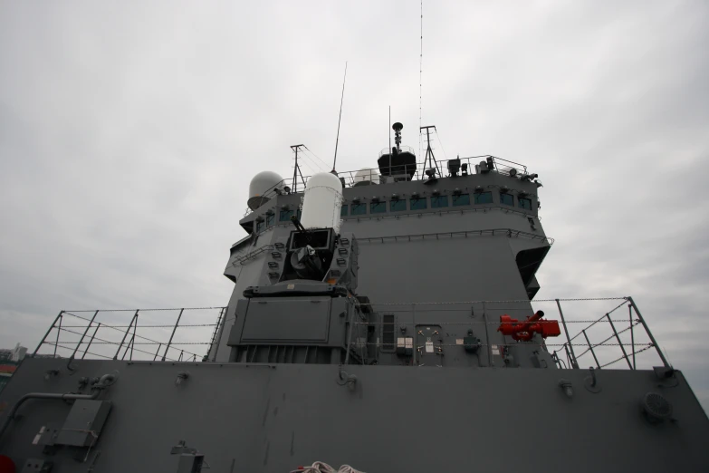 the back of a military ship with masts