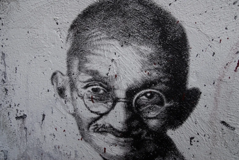 an artistic drawing with a man's head wearing glasses