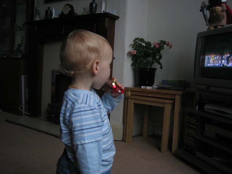 a child in the living room looking at soing