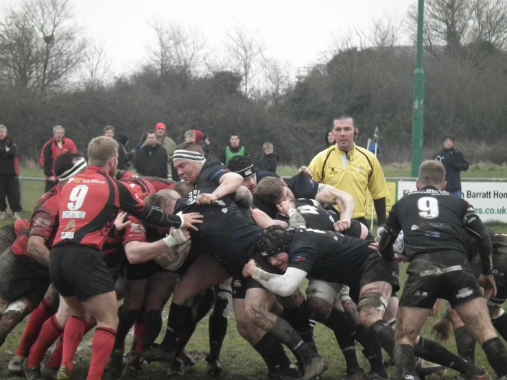 a group of men playing a game of rugby