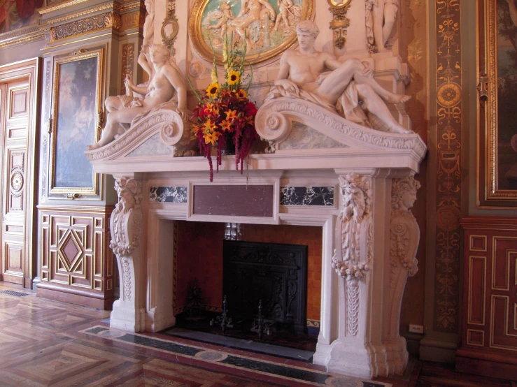 a fireplace with a statue in the middle