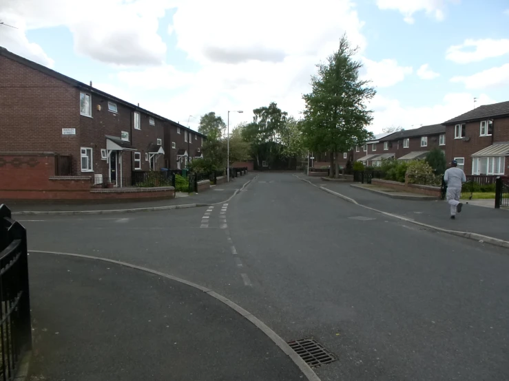 the person is walking down a quiet street