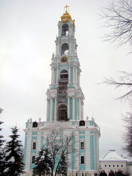 a large clock tower near some trees