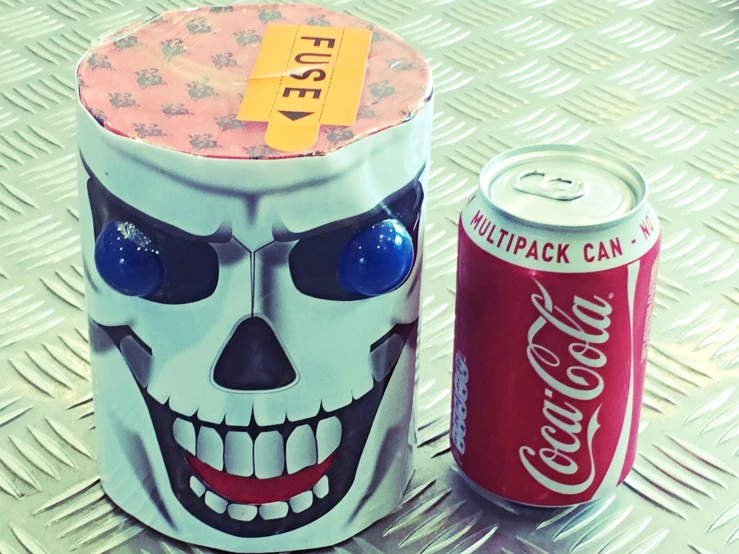 the can of coke has been decorated as a zombie