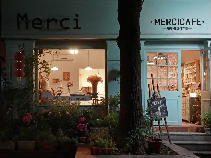 a flower shop with a sign that says merrici