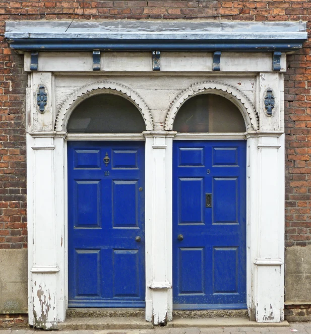 the two blue doors are in a building