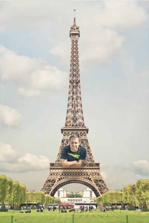 a person that is posing for a po near the eiffel tower