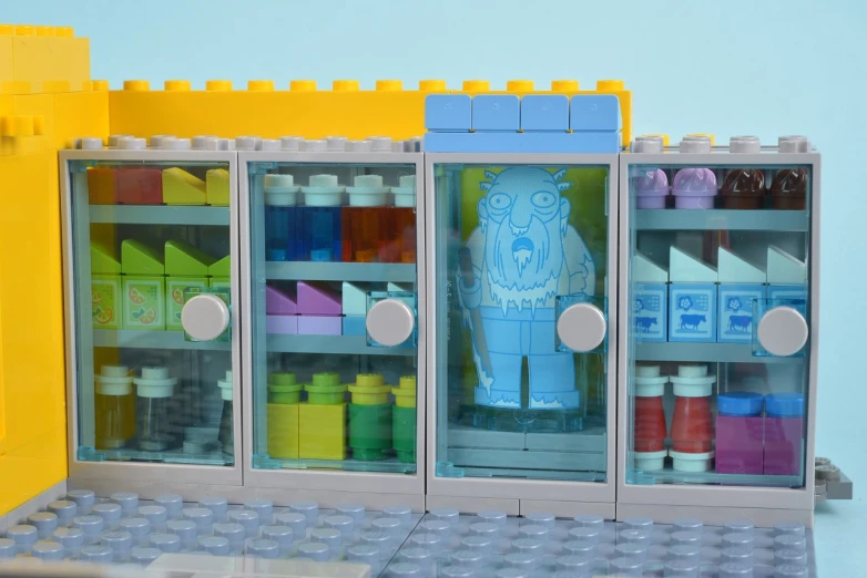 a building made out of lego bricks and a display case full of lego glues