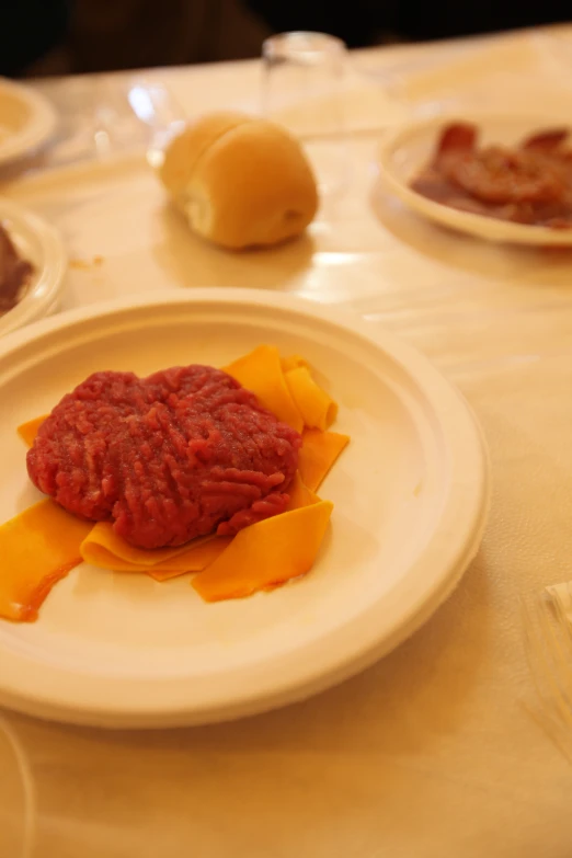 two plates of food on the table with condiments