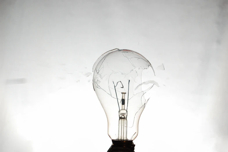 an old - fashioned light bulb sitting in the sun