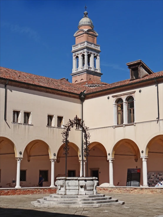 a building has arches and a clock tower