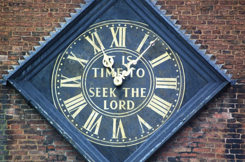 a very tall clock on the side of a building