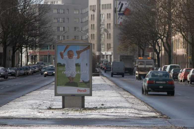 an advertit for a baseball team sits on the street