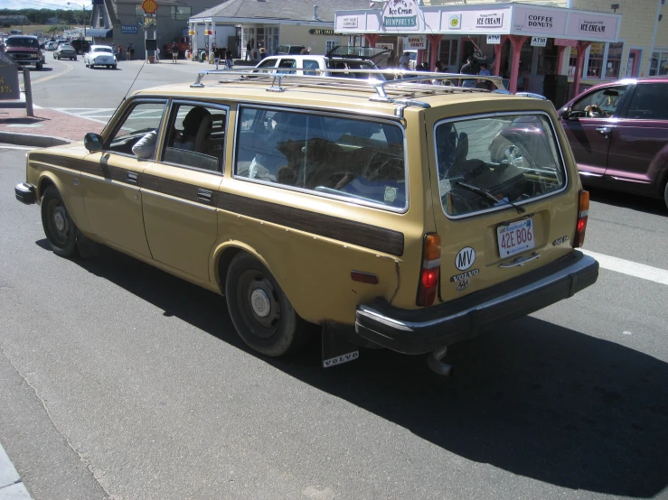 a minivan is parked on the side of the road