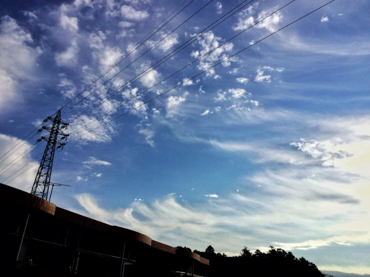 a big tall structure with lots of power lines