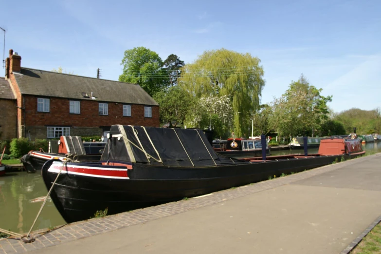 a group of boats parked along the side of the road