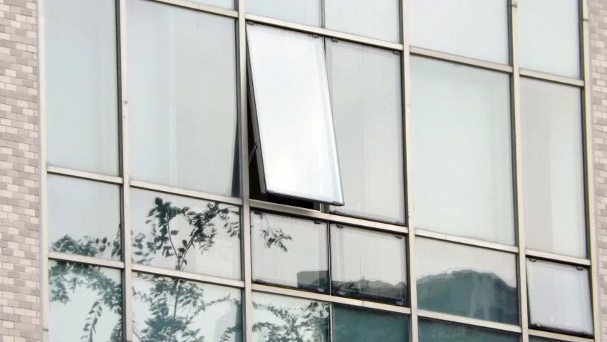 a close up of a window near the top of a building