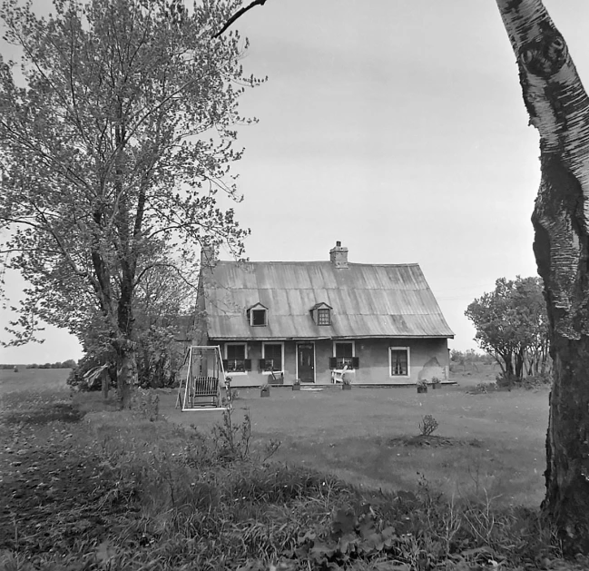 the old farmhouse is nestled in a secluded setting