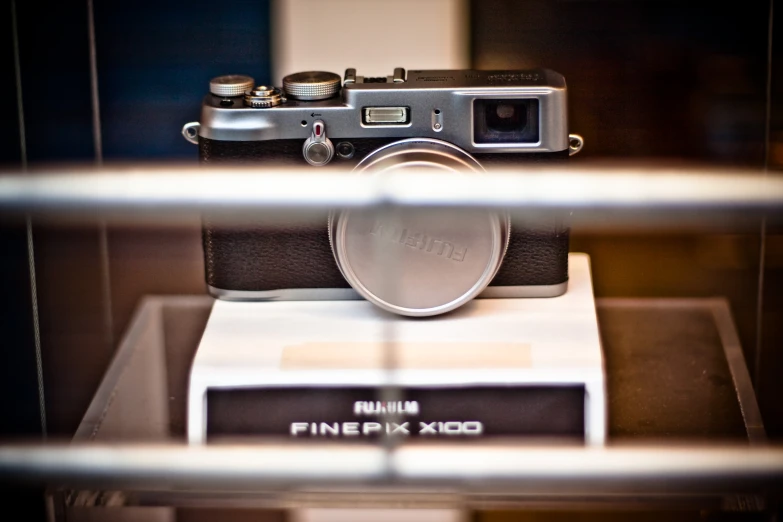 an old fashioned camera in a display case
