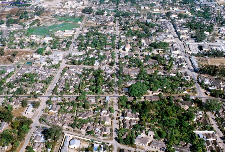 an aerial view of a village from an airplane